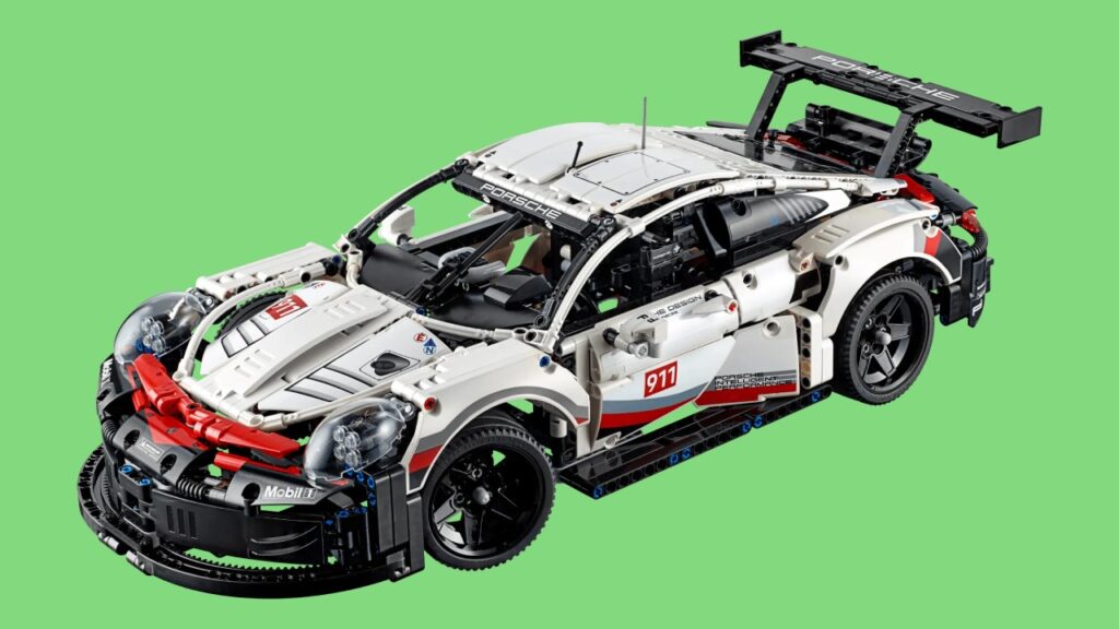 The LEGO Technic Formula E Porsche 99X Electric against a green background.