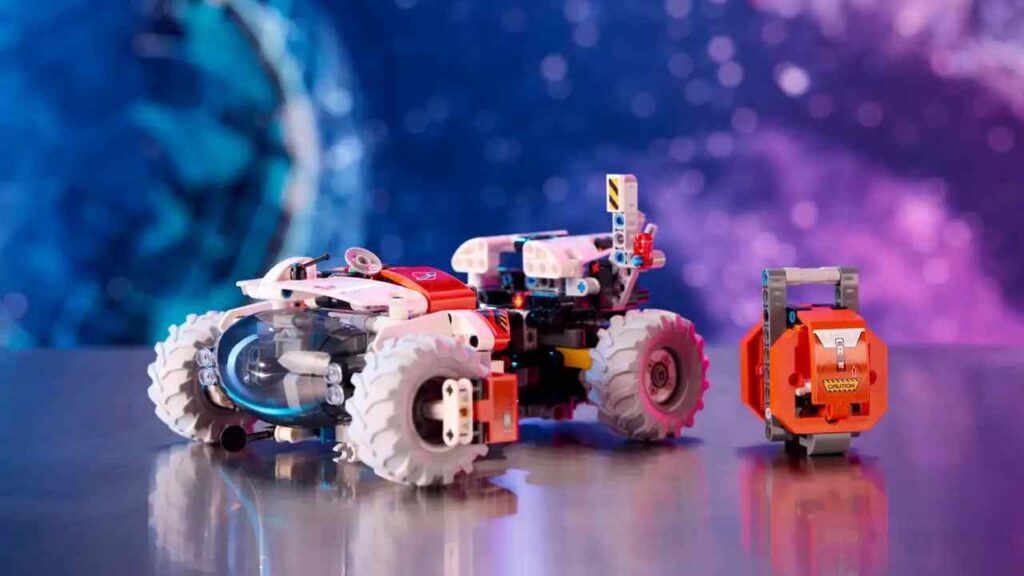 The LEGO Technic Surface Space loader against a cosmic background.