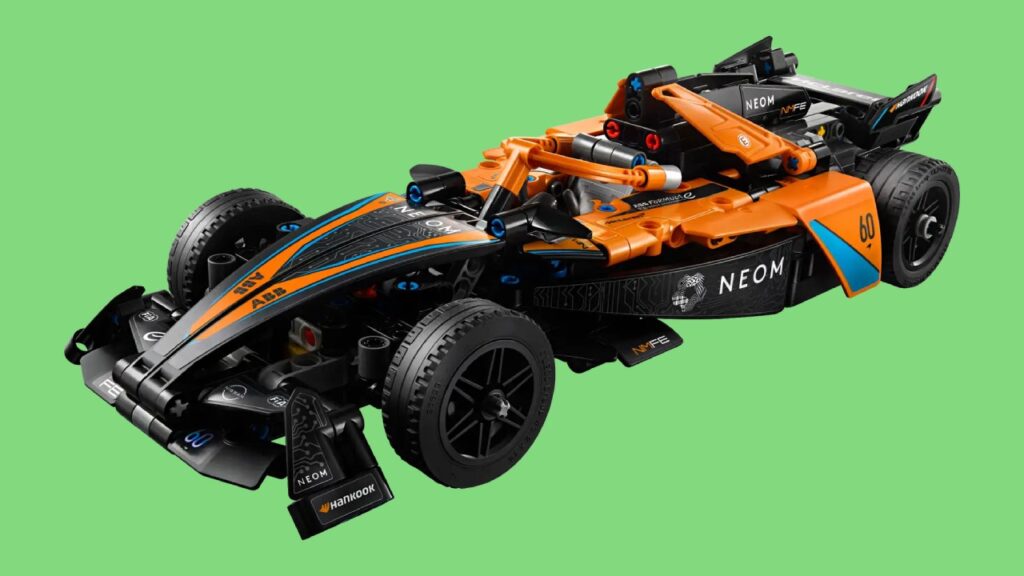 The NEOM McLaren Formula E Race Car against a green background.