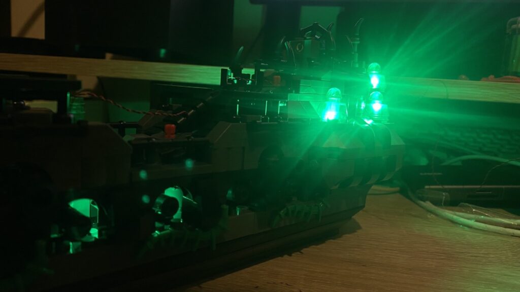 The JMBricklayer Ghostship lighting on display. Bright green beams.